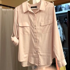 Champagne color with silver buttons. Fabric is 100% polyester.